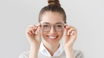 woman holding glasses