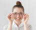 woman holding glasses