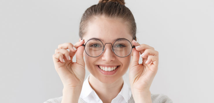 woman holding glasses