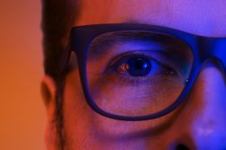 blue light man wearing glasses