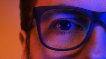 blue light man wearing glasses