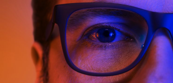 blue light man wearing glasses