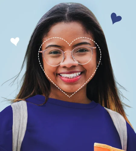 Smiling woman wearing glasses with a dotted heart outline illustrating a heart-shaped face shape.